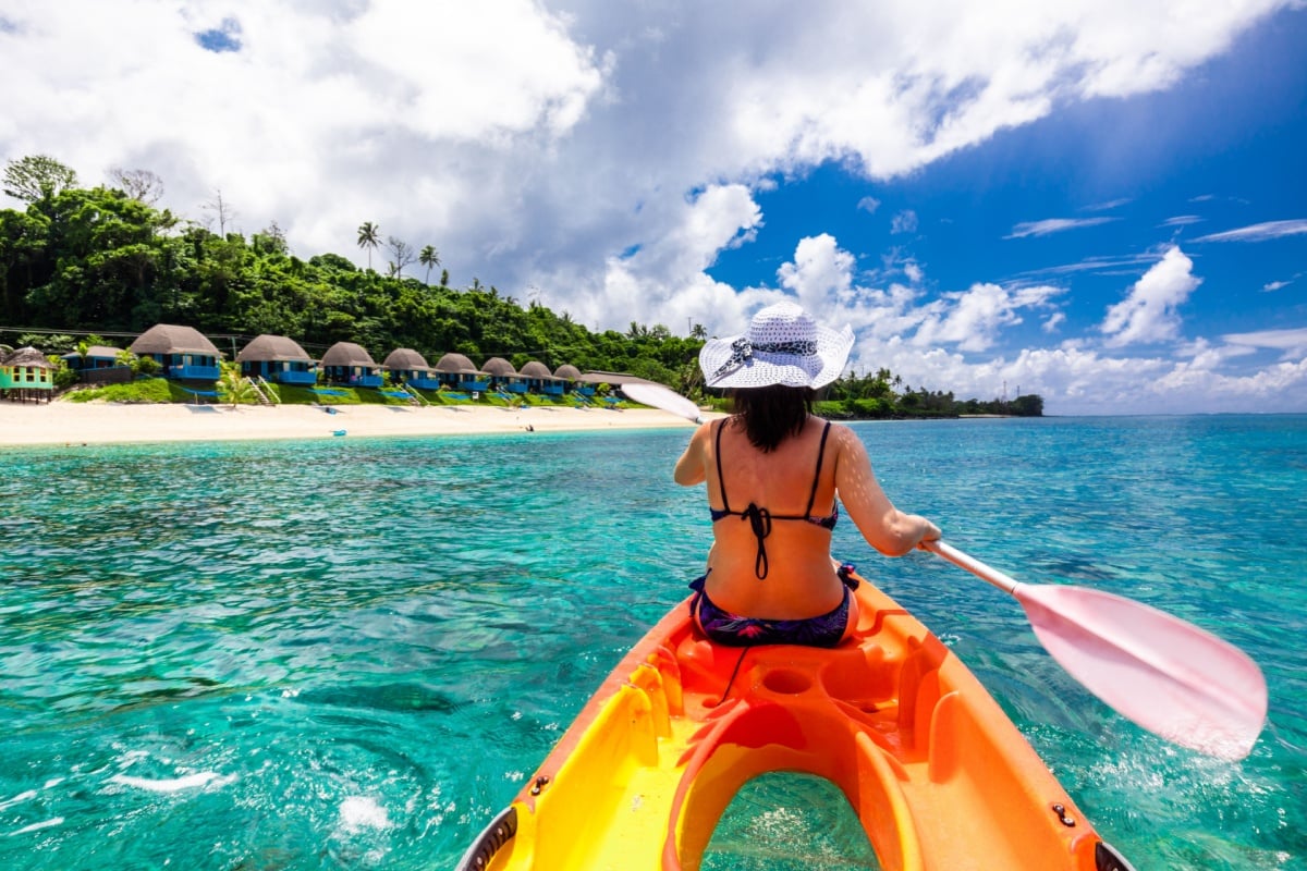 Woman kayaking in Fiji